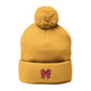 Cozy Pom-Pom Coquette Knit Cap with Embroidered Red Bow